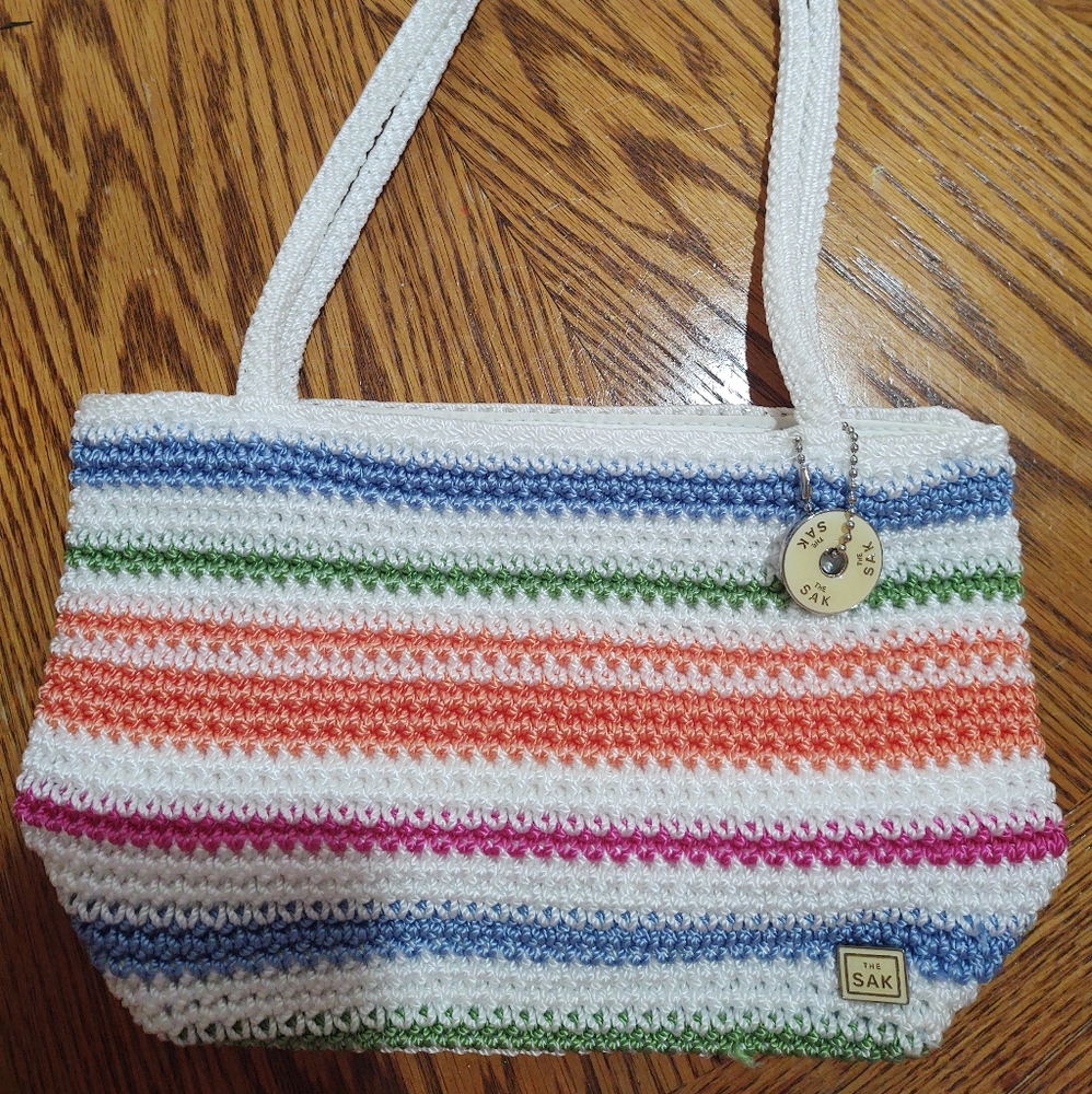 The Sak small handbag.  Multi striped. 10" wide and 3" across the bottom.